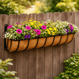 jute manger full of flowers on a garden fence