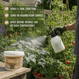 A person in a garden sprays plant leaves with a white pressure sprayer while a tub of Garden Naturally kaolin clay