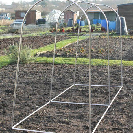An empty aluminum hoop frame designed for use as a plant cage in a garden setting.