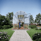 Glass greenhouse with open door in a garden setting