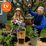 Two people in a garden setting with plants and a beehive, featuring 'As Seen on TV with Alan Titchmarsh' logo.