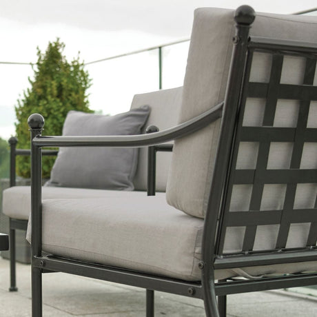 metal backed garden chair set with grey cushions