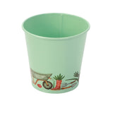 A mint green pot for storing plant labels