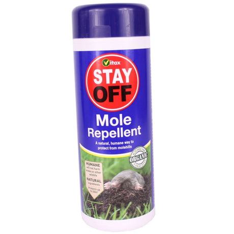 A bottle of Vitax Stay Off Mole Repellent with a graphic of a mole and grass in the background.