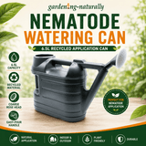 A black recycled plastic nematode watering can with a spout and rose head, shown on a wooden surface with a blurred garden background. The image features promotional text and icons highlighting features like 6.
