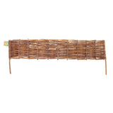 woven natural willow garden border fence on white background