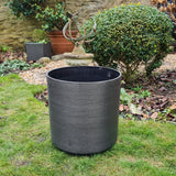 obsidian grey plant pot in garden