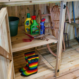 internal picture of wooden shelving with garden tools and equipment