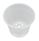 A clear, plastic orchid pot with a translucent design, featuring large holes for drainage and light penetration.