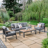A grey couch with two pillows resting on it