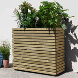 Tall wooden planter box with plants against a light background