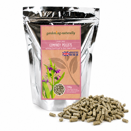 Comfrey pellets packaging with visible pellets on a white background