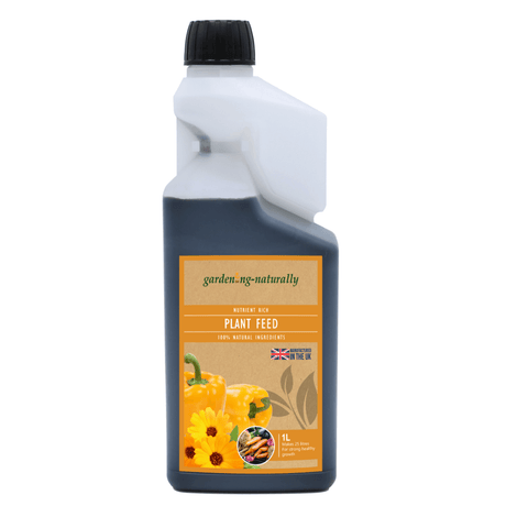 A 1L bottle of gardening naturally Nutrient Rich Plant Feed, featuring a dark gray bottle, white neck, black cap, and an orange and beige label with yellow flowers and vegetables.