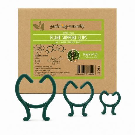 Green plant support clips in front of a cardboard box labeled 'garden.naturally' with product details.