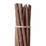 Bundle of wooden sticks tied with twine on a white background