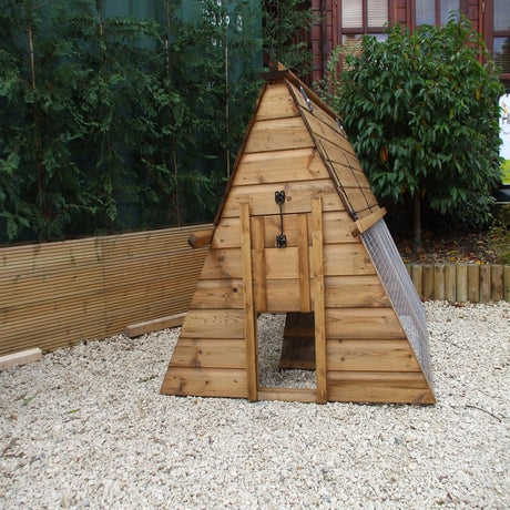 pyramid shape hen house in a garden on gravel