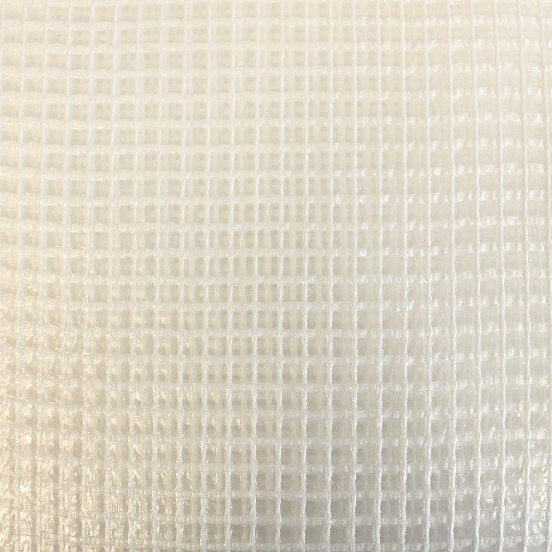 Close-up of a textured beige fabric with a subtle pattern