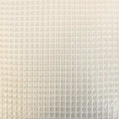 Close-up of a textured beige fabric with a subtle pattern