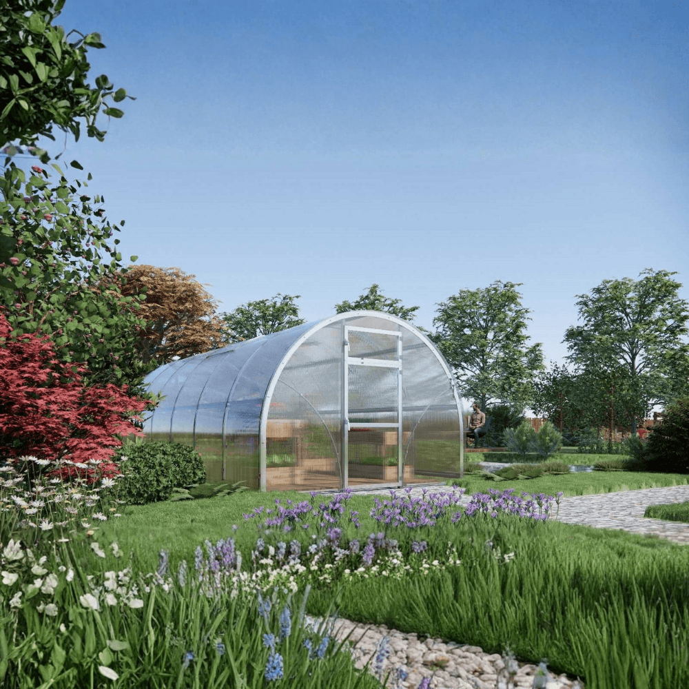 Garden with a greenhouse surrounded by greenery and flowers