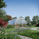 Garden with a greenhouse surrounded by greenery and flowers