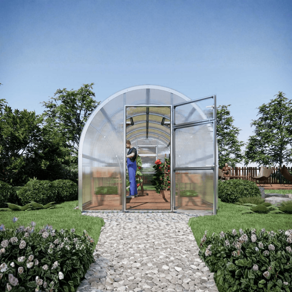 Small greenhouse with transparent walls in a garden setting