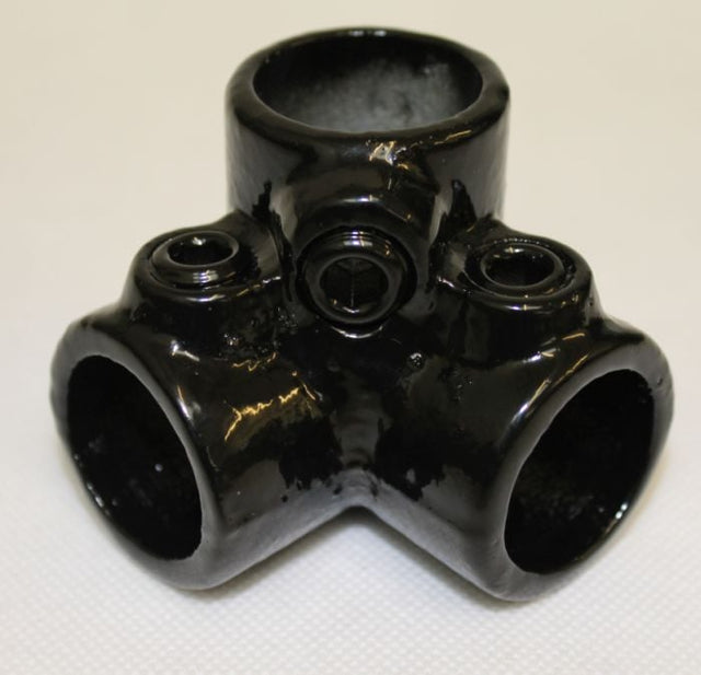 A black metal corner connector for fruit cages, with multiple tube connections.