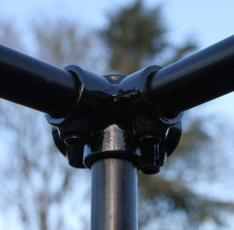 Corner connector for black premium fruit cage shown on  a fruit cage