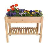 Wooden raised garden bed on legs with colorful flowers on a white background