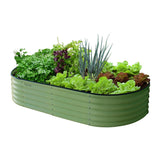 sage green raised bed with plants in