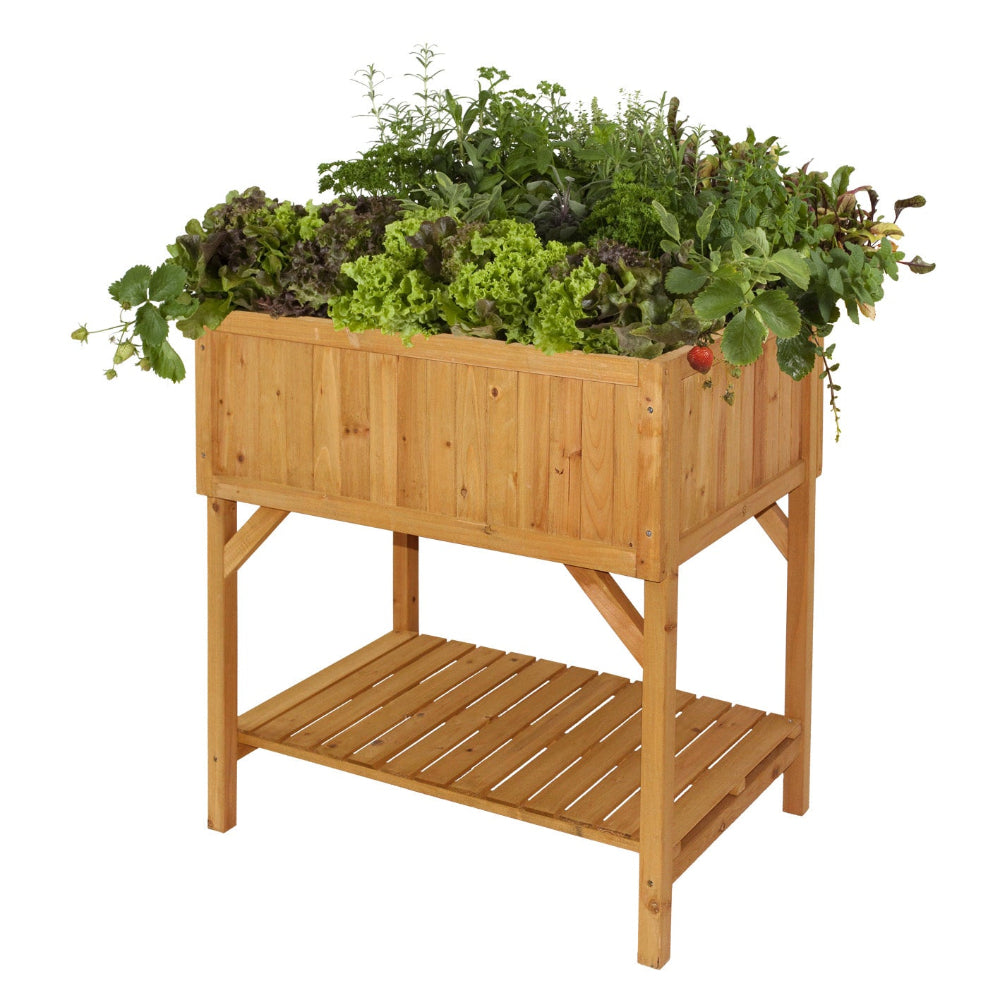 wooden vegtrug raised bed planter with plants in