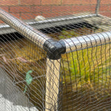 corner joint of an aluminium pond protection frame with black butterfly netting protection