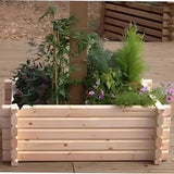 outdoor wooden build-around planter with flowers and plants inside