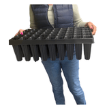 Person holding a large root trainer