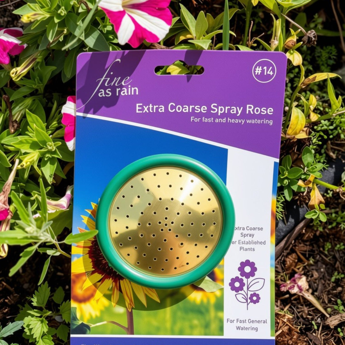 Fine as Rain Extra Coarse Spray Rose  in its original retail packaging, displayed against a background of green garden foliage and pink flowers. 