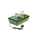 Green and clear propagator with power cord on a white background