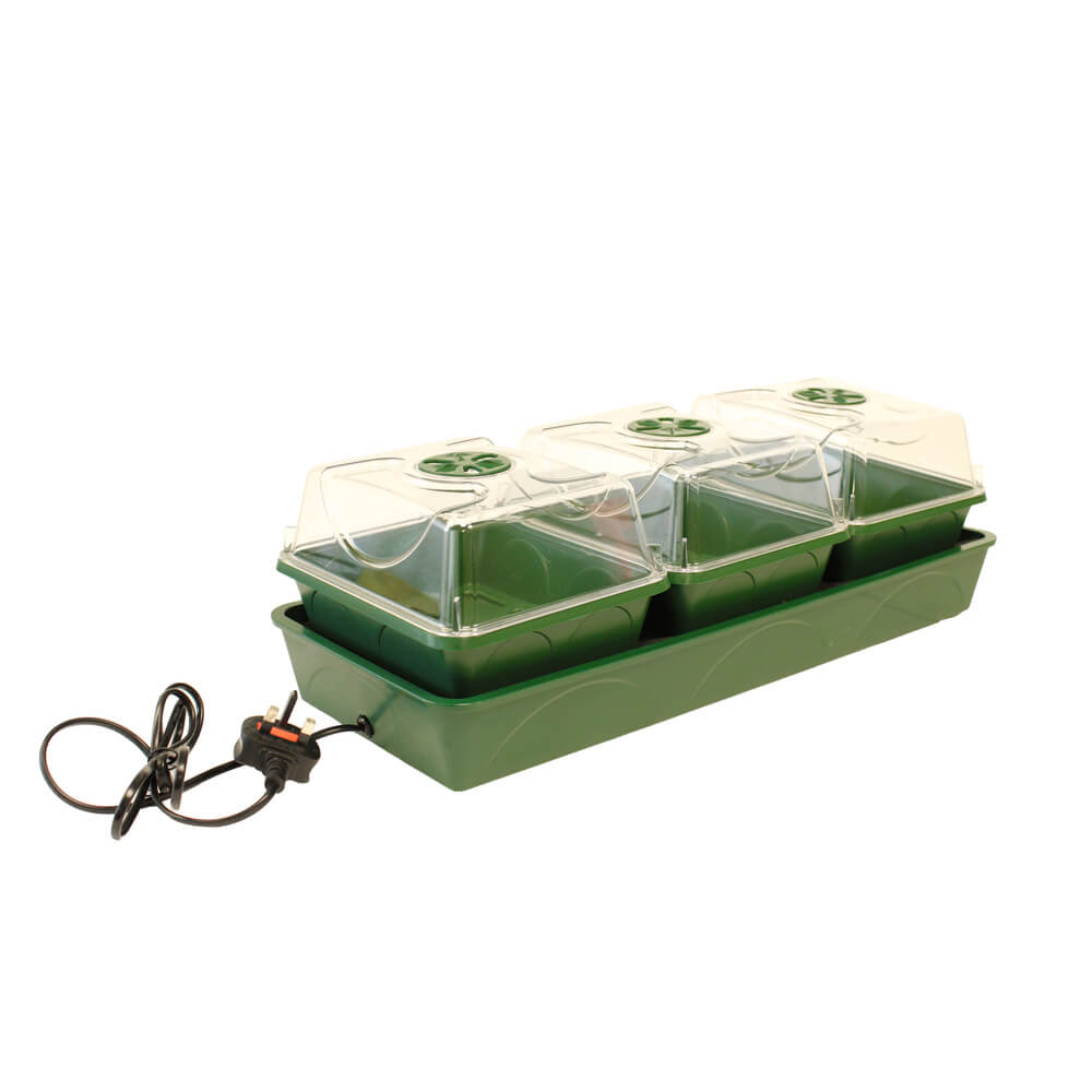 Green and clear plastic seedling tray with heating element on a white background