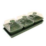 Green garden tray with transparent covers on a white background