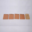 Set of brown paper pads with month labels on a white background