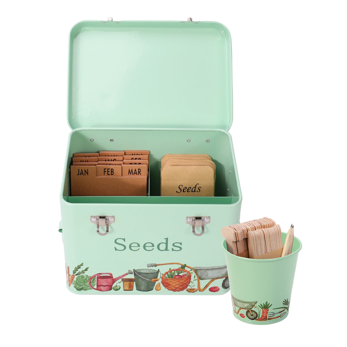 A mint green metal seed starter kit with an open tin labeled 'Seeds' and a matching cup holding wooden labels and a pencil. Inside the tin are brown seed cards organized by month, all on a clean white background.