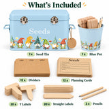 A product bundle for a garden seed starter kit, featuring a light blue metal seed tin with gnome illustrations, a matching blue pot with wooden plant markers, and various natural wood labels, dividers, and pencils. The image includes a 'What's Included' header with labels for each component.