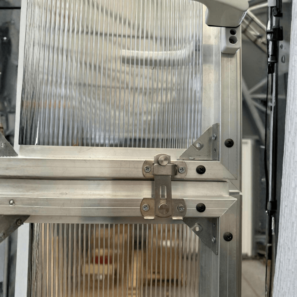 Close-up of a metallic machine component with a blurred background