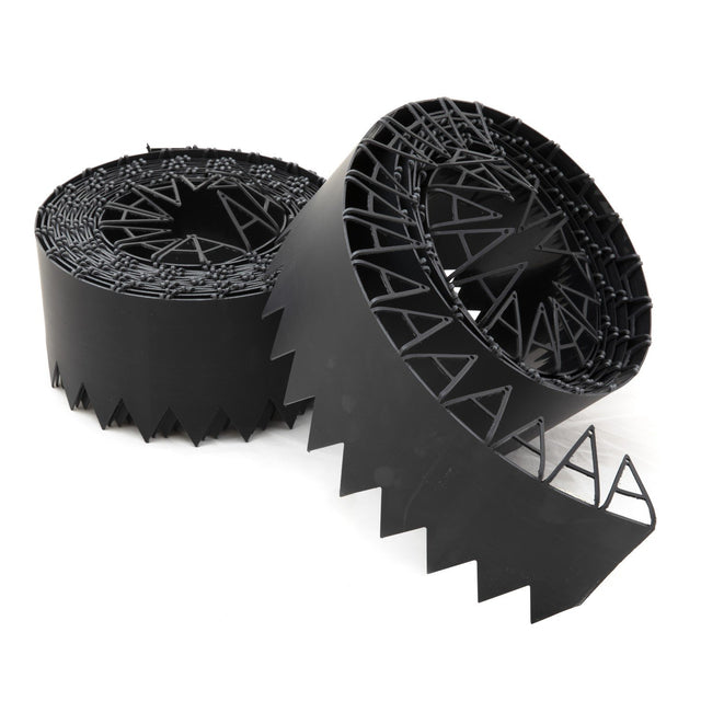 Rolls of black flexible lawn edging with a zigzag design, including securing pins.