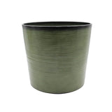 Green planter pot with black rim on a white background