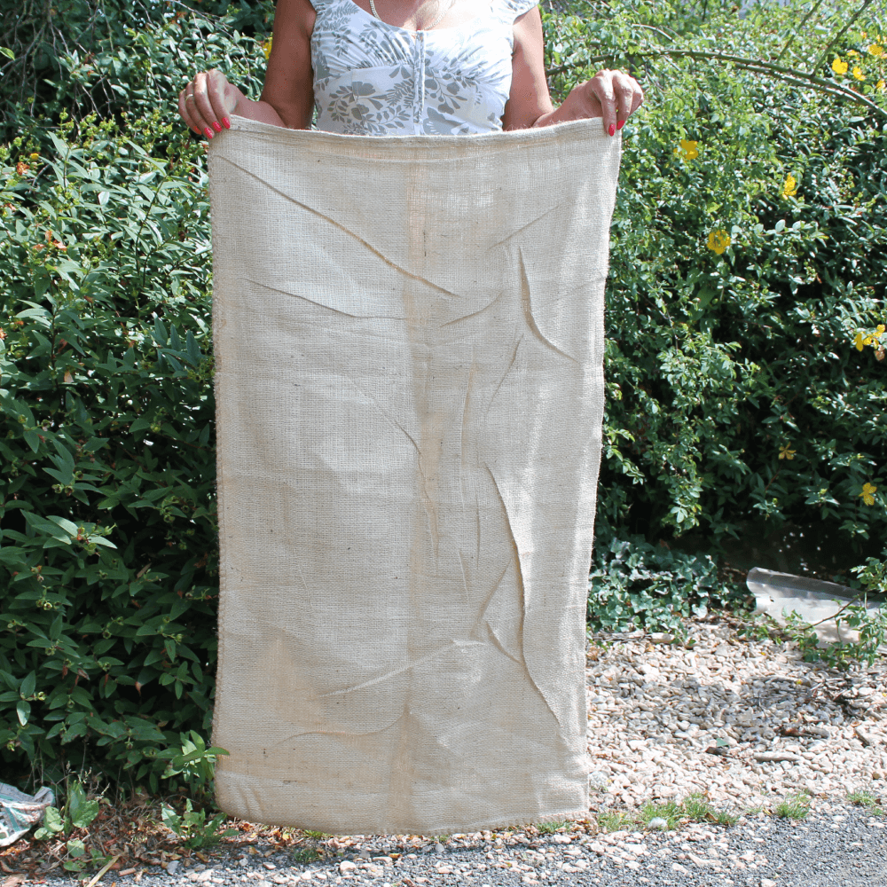 Lady holding standard size potato sack