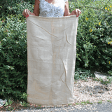Lady holding standard size potato sack