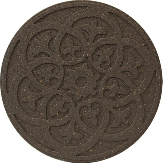 A round, brown reversible stepping stone with a detailed scroll design