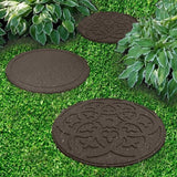 Stepping stones on lawn going between bushes