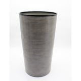 Tall gray textured vase on a white background