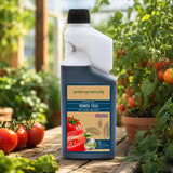 Gardening naturally tomato feed bottle with tomatoes and plants in the background