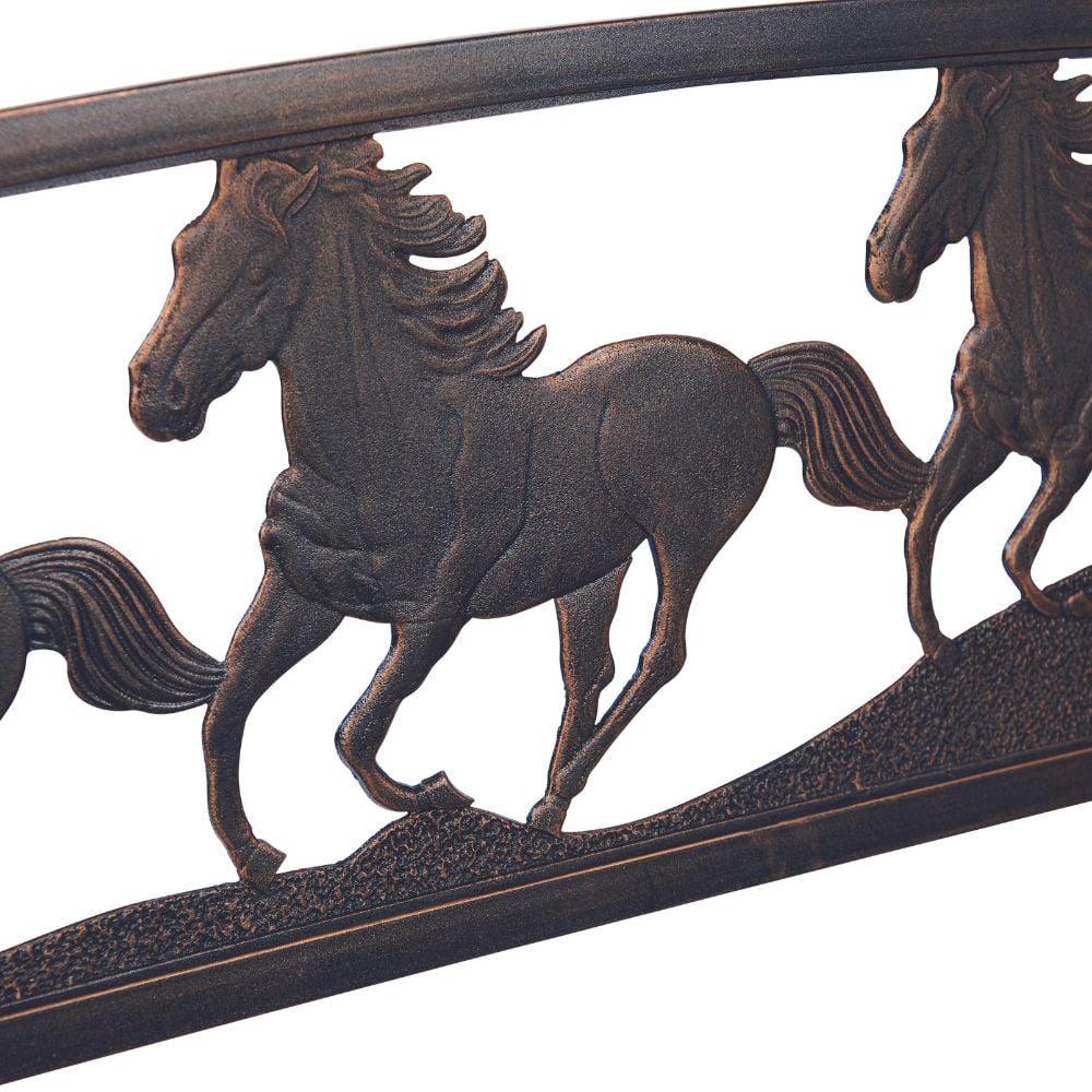 A decorative iron horse head with three horses running